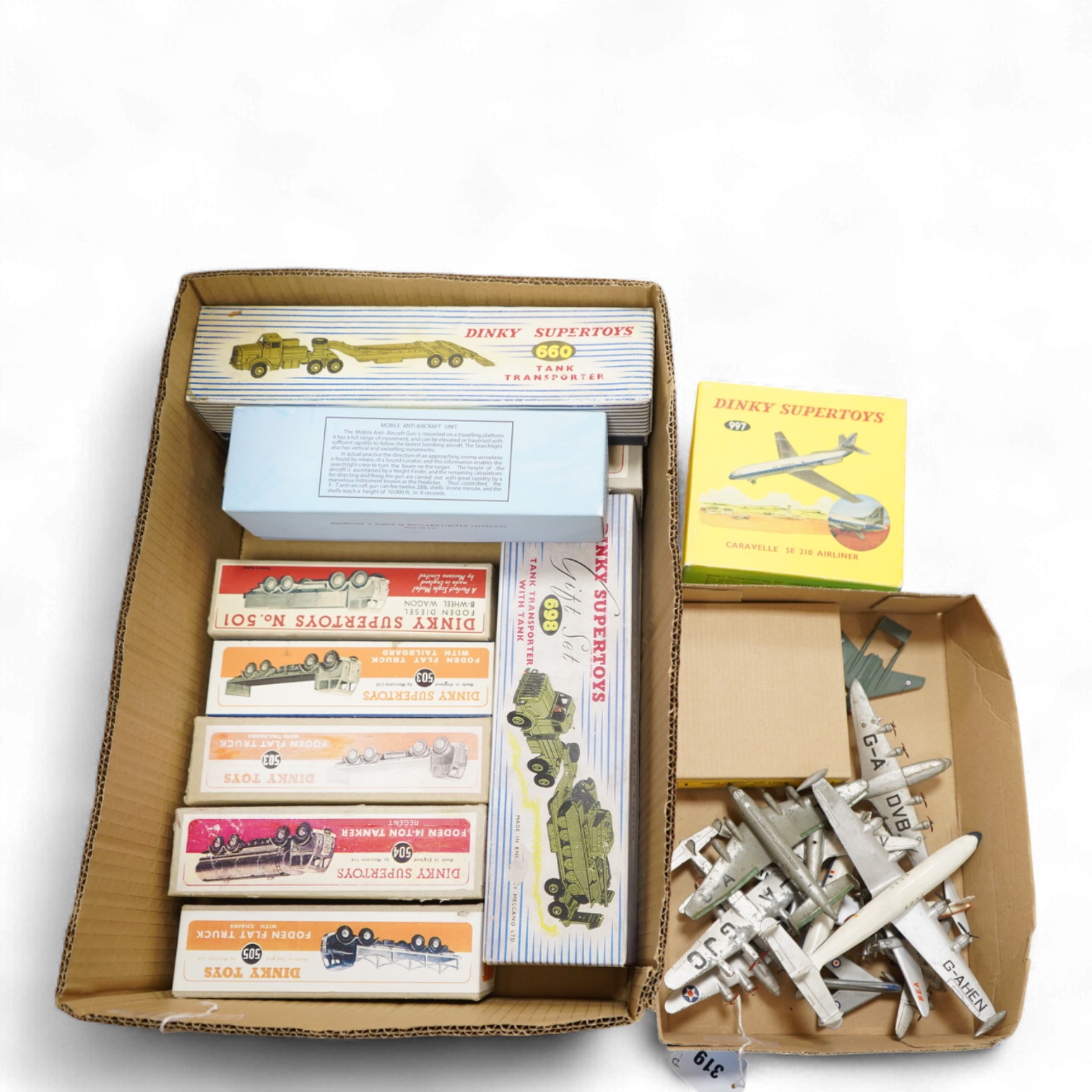Twenty-three Dinky Toys and Supertoys, all playworn, restored, repainted or overpainted, (twelve in reproduction boxes), twelve aircraft, five Foden, 8-wheel commercial vehicles, a tank transporter with Centurion tank, a